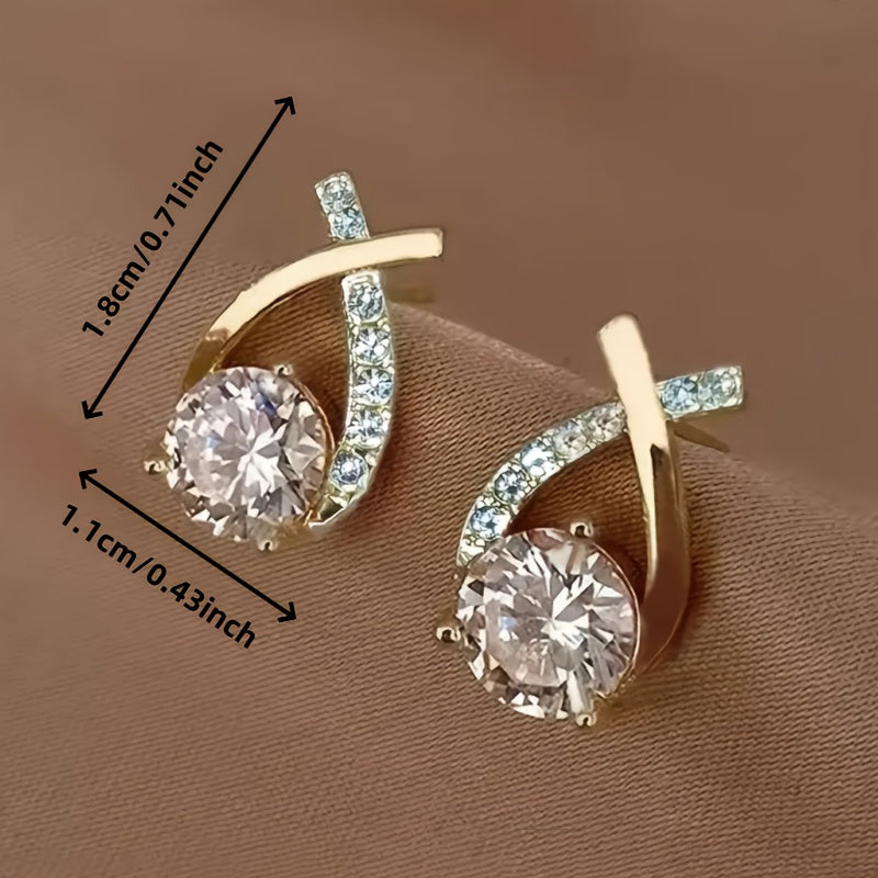 Boucles d'oreilles avec croix dorée et zirconium