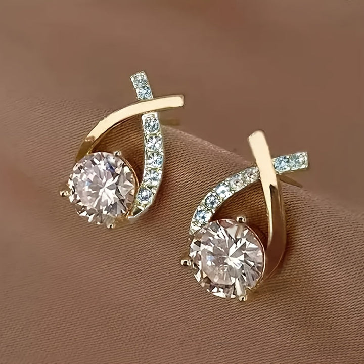 Boucles d'oreilles avec croix dorée et zirconium